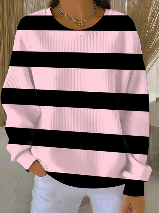 Női stílusos rózsaszín és fekete csíkos pulóver